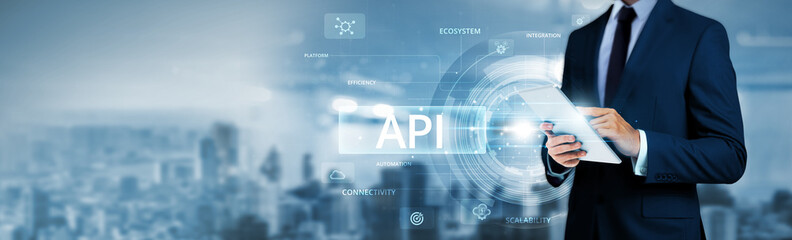 API, businessman using tablet analyzing real-time application data and integrated service network,...