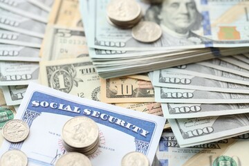 American US dollars money bills and US social security number card close up