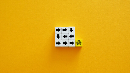 Arrows in a maze leading to a goal. Problem solving.