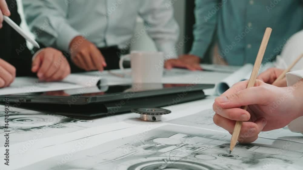 Poster a dynamic scene in a modern office showcasing professionals engaged in a brainstorming session, revi