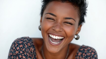 A lively African American woman laughing joyfully, radiating happiness, isolated on a white background