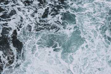 Captivating ocean waves with foamy patterns and turbulent sea texture