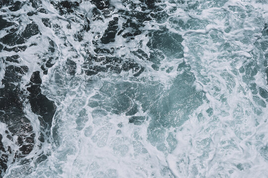 Captivating ocean waves with foamy patterns and turbulent sea texture