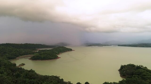 Storm Clouds Loom Over a bili bili Reservoir Lake in the Late Afternoon in sulawesi