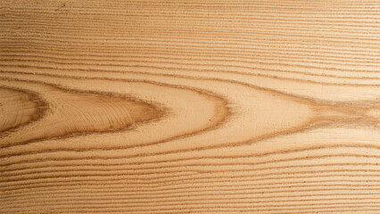Fototapeta premium Close-up view of a light beige wood grain texture.