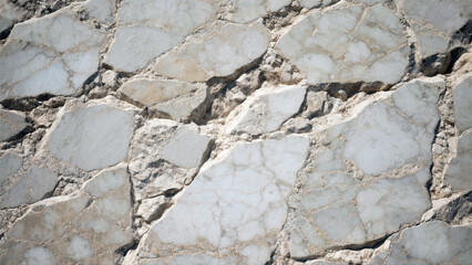 Fototapeta premium Close-up view of weathered white marble stonework.