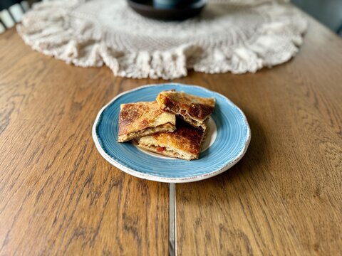 Homemade Alt ust boregi or Rumeli Borek on wooden table