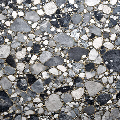 Abstract Stone Texture: A captivating and detailed view of a stone texture, showcasing the intricate composition of different stone fragments and small pebbles.