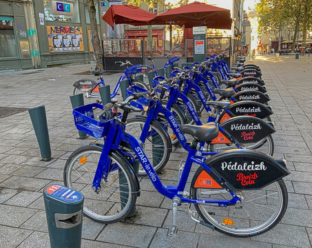 Rennes, France - October 1, 2023: Rental bikes in a docking station: part of the city&rsquo;s popular public transportation network. Pedaleizh is their Breton name. Le velo is &ldquo;the bike."