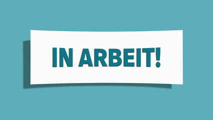 In Arbeit (In progress) - A card isolated on light green background.