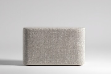 Fototapeta premium Neutral-toned fabric speaker on a minimalist background.