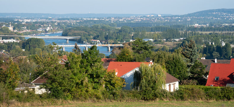 Panoramic top view of Andresy town, the Seine river with bridges and the valley. Yvelines, Ile-de--France, France