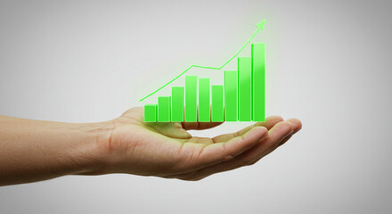 Growing Business Success: Hand Holding Green Graph Real estate business ,technology ,selling ,purchasing ,agreement ,$
