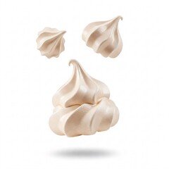 Falling white meringues isolated on white background.