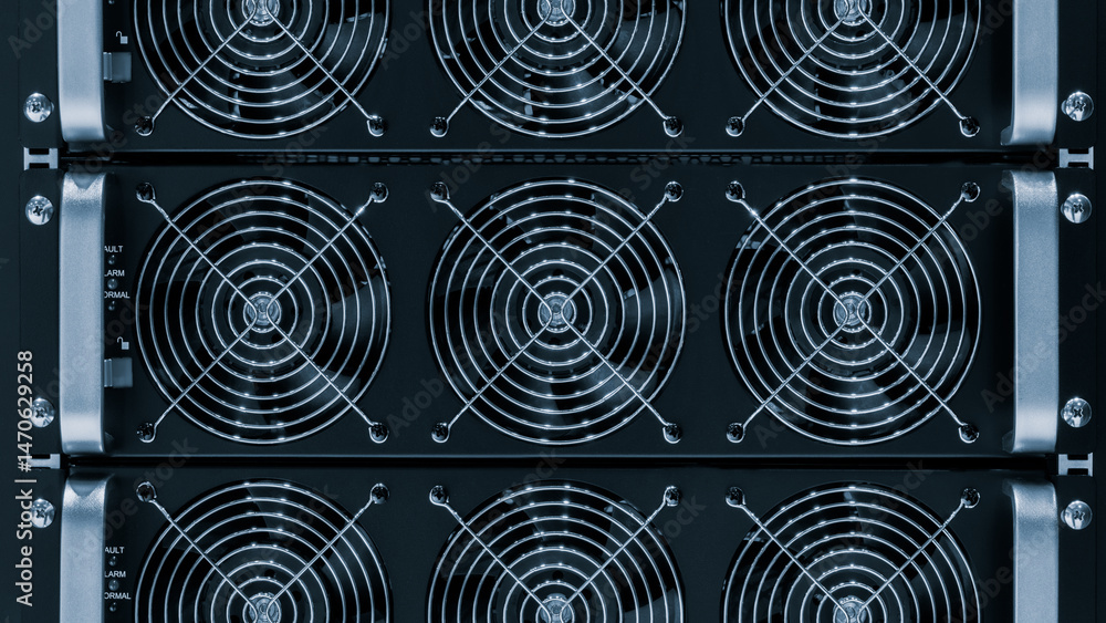 Poster a black computer tower with a large fan on the top. the fans are black and silver. the tower is made