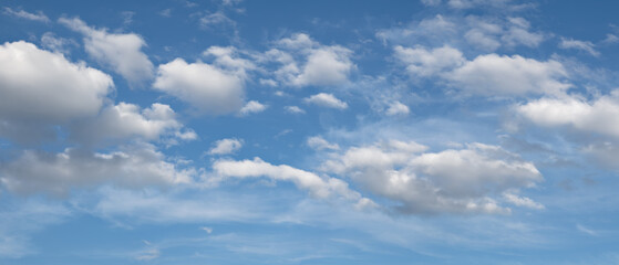 heaven sky is blue with a few clouds scattered throughout. The clouds are white and fluffy, giving the sky a peaceful and serene.