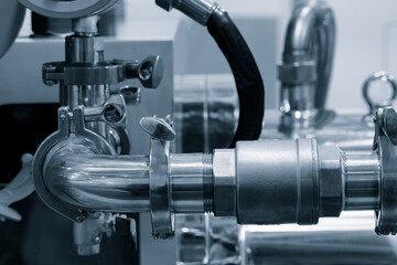 A pipe with a valve on it. The valve is open. The pipe is silver.