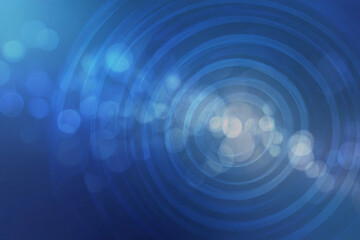 Obraz premium Abstract blue background with concentric circles and bokeh effect, creating a sense of depth and movement, ideal for modern designs or presentations