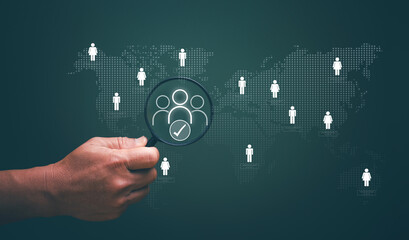 Human Resource Management or HRM, Senior executives using magnifier glass focus to manager icon and choose for recruitment leadership in clusters and human development. Employee recruitment.