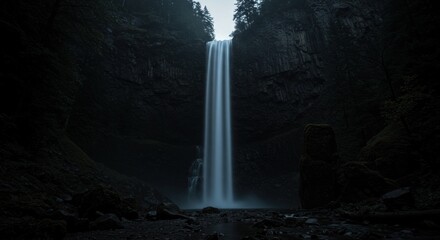 Waterfall in a Dark Canyon - Photo