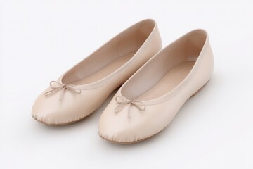 Fototapeta premium Pair of beige ballet flats with dainty bows. Simple, elegant footwear.