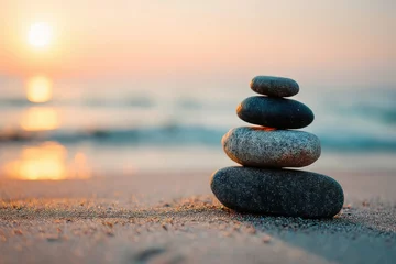 Keuken achterwand Stenen in het zand A calming image of a balanced stack of stones on a sandy beach during a sunset, symbolizing peace, harmony, and a zen lifestyle with a blurry sea background.  © whitestorm