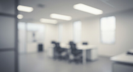 Blurry office space with desks chairs and lights creating a modern and professional atmosphere seen indoors