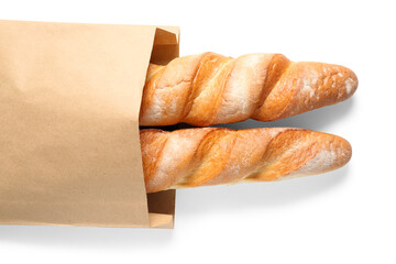 Paper bag with fresh baguettes on white background