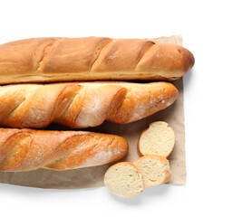 Paper with fresh baguettes on white background