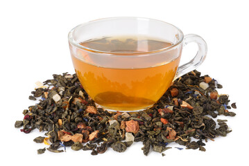 Delicious herbal tea in glass cup and dry leaves isolated on white