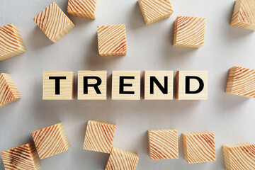 Word Trend made of wooden cubes with letters on white background, top view