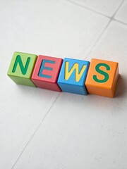 Colorful cubes forming the word news for World Press Freedom Day activities in a creative setup