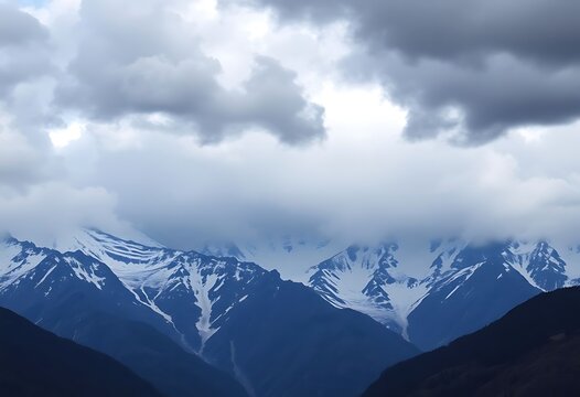 mountain range with snow capped mountains in the background