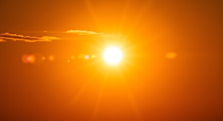 Fiery Sunset: A Blazing Sun Sets Over a Golden Sky