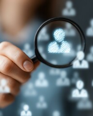 Fototapeta premium decision makers digital persona marketing shopper target audience A person holds a magnifying glass, focusing on digital icons representing individuals, symbolizing analysis and research.