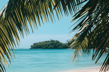 Fototapeta premium Tropical island paradise viewed through palm fronds