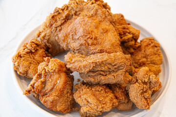 Close-up of a stack of deep-fried boneless chicken pieces. Crispy outside, juicy and succulent inside, smelling delicious.