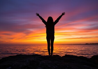 A silhouette of a woman with open arms, embracing a vivid, colorful sunset over the sea.