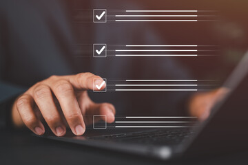 Businessman finger selecting checklist item on virtual interface, representing task management, productivity, planning, decision making, and digital workflow in modern business.