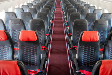 Empty interior of a narrow-body cabin of an airplane produced in 2025 year. Inside of modern...