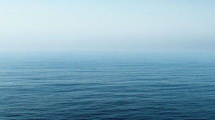 Obraz premium Serene Ocean Horizon - A Peaceful Blue Landscape blue background