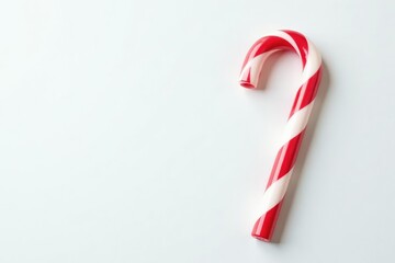 Striped red and white candy cane on pure white background, decoration, photography