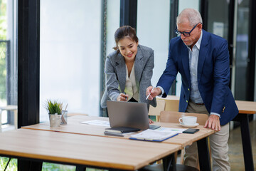 Two Business working at office with documents on his desk, doing planning analyzing the financial report, business plan investment, finance analysis concept	

