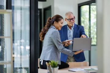 Two Business working at office with documents on his desk, doing planning analyzing the financial...