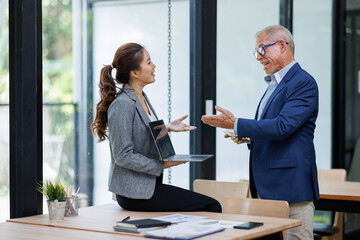 Happy business people smiling business man and  business women working together in office
