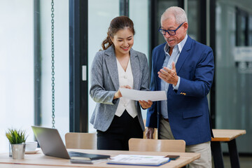 Happy business people smiling business man and  business women working together in office
