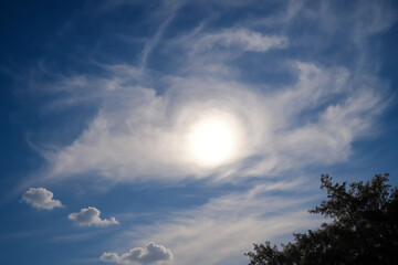 Obraz premium moon and clouds. clouds and sun. sky view with bright sun, clouds, blue sky