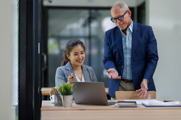 Happy business people smiling business man and  business women working together in office
