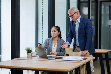 Happy business people smiling business man and  business women working together in office

