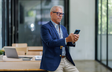 Senior businessman Successful Digital Device in Stylish Office Setting business people working concept.